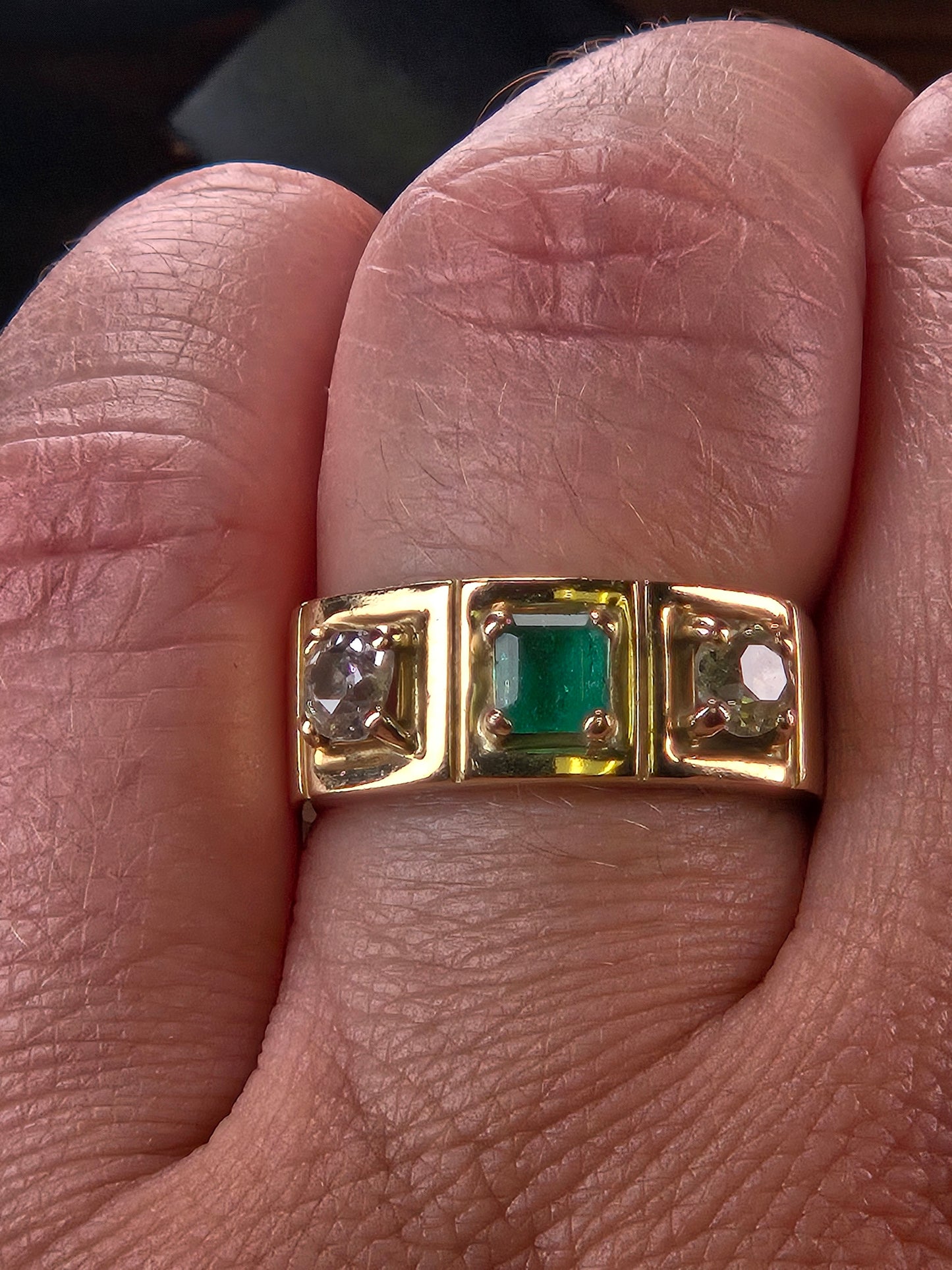 A model's hand wearing The Empress vintage three-stone ring to demonstrate its scale and how it looks as a wedding band.