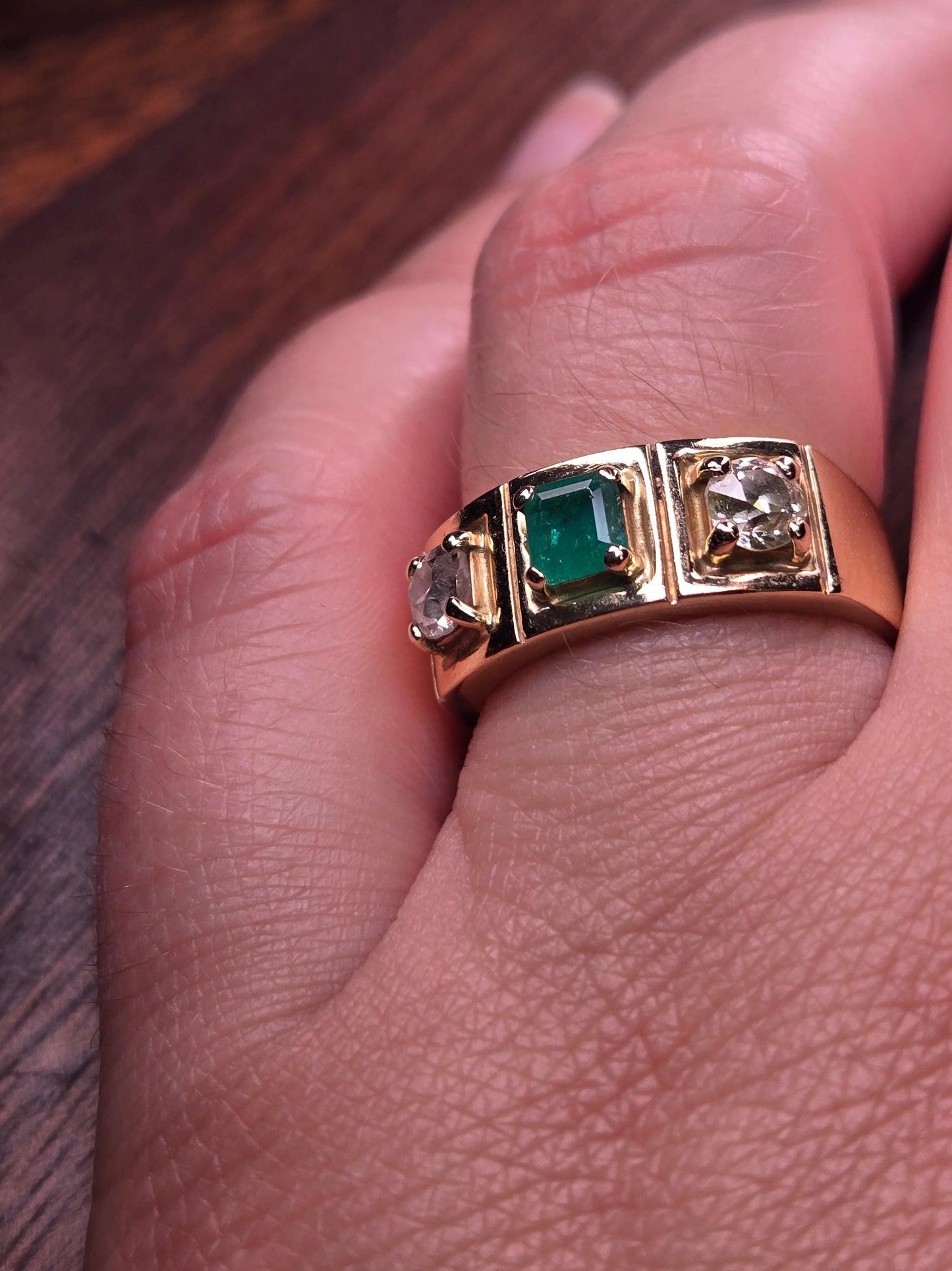 A model's hand wearing The Empress vintage three-stone ring to demonstrate its scale and how it looks as a wedding band.