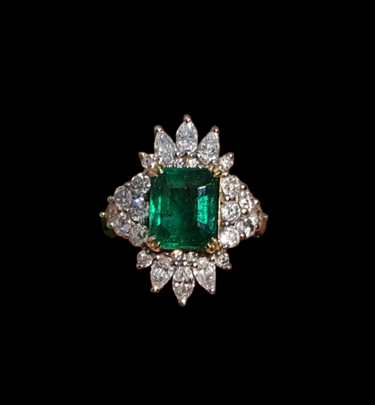 Close-up of Emerald City Skyline ring featuring a 3.11 carat Zambian emerald and 1.91 carats of halo diamonds set in 14K white gold.