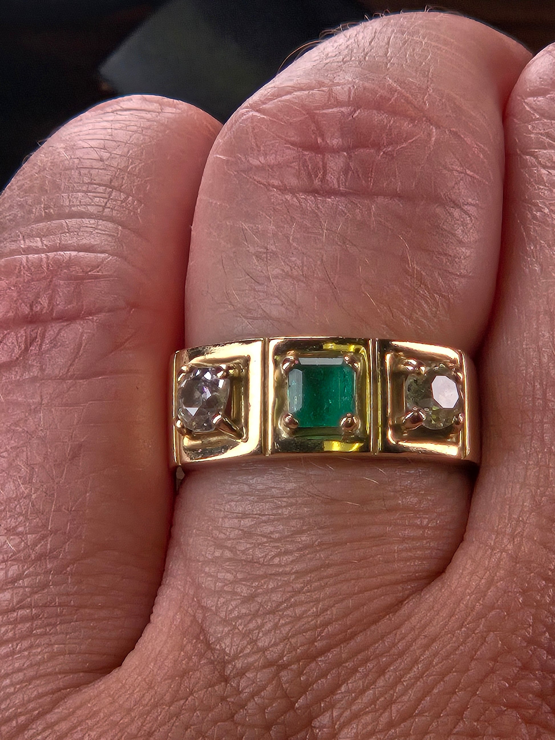A model's hand wearing The Empress vintage three-stone ring to demonstrate its scale and how it looks as a wedding band.